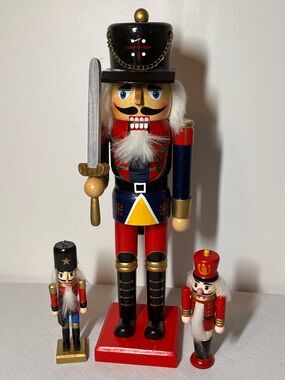 Wooden Nutcracker Soldier 14”. Two smaller ones too. 
Like New